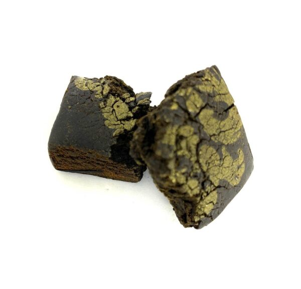 Dark black hash block with Red Dragon Gold Seal branding, premium compressed cannabis concentrate