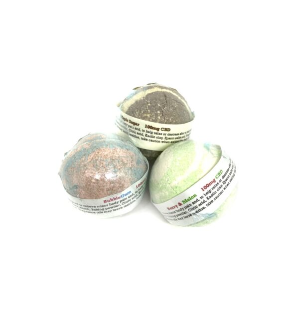 Group of colorful infused CBD and THC bath bombs in assorted scents including berry, vanilla, and citrus varieties