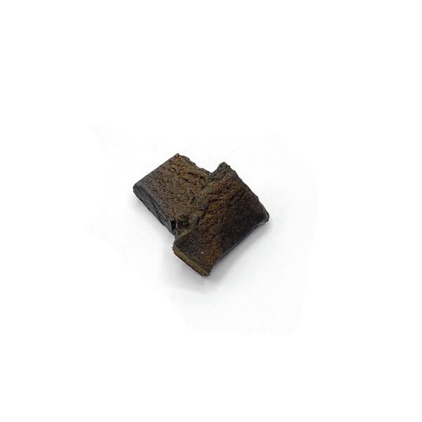 Dark brown Moroccan hash block with earthy texture, traditional pressed cannabis concentrate