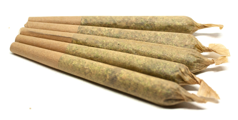 Five pre-rolled cannabis joints displayed together, tightly packed and neatly arranged