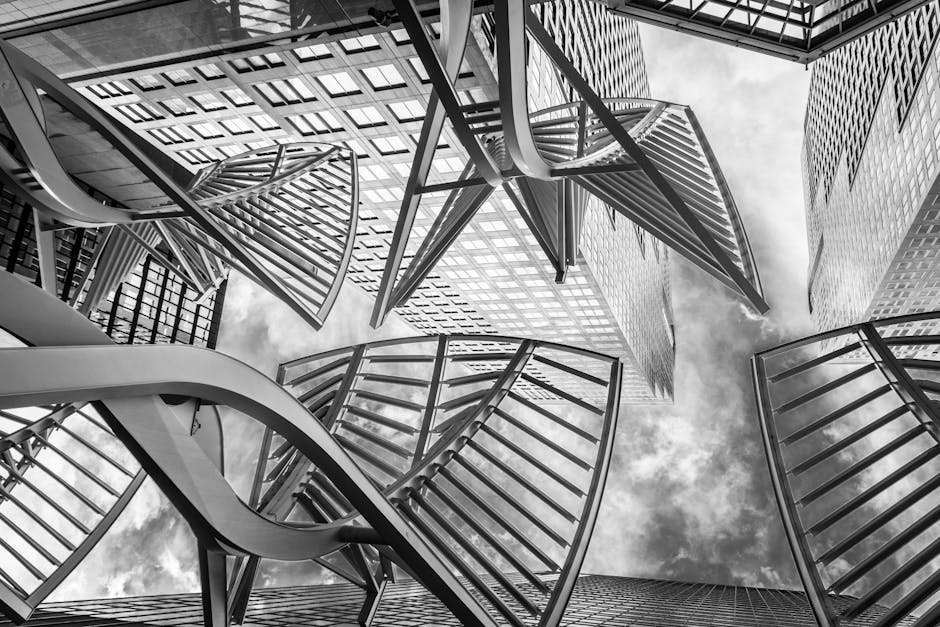 Black and white view of Calgary's modern skyscrapers with distinctive architectural designs.