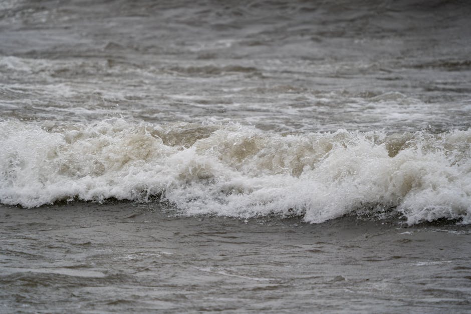 Dynamic waves hitting the shoreline of Lake Ontario, captured in Hamilton, showcasing nature's power.