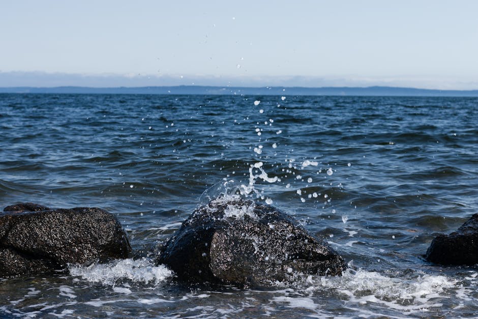 Dynamic ocean waves crashing against rocks on the St. Andrews coastline, Canada.