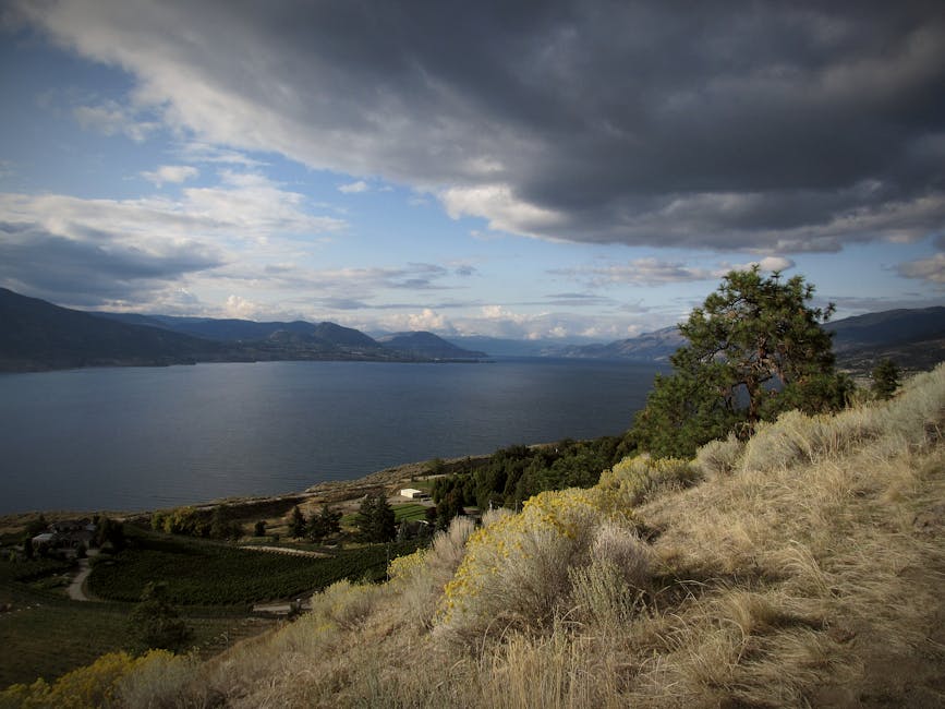 Dramatic landscape of Okanagan Lake with clouds and hills in Penticton, BC, Canada.