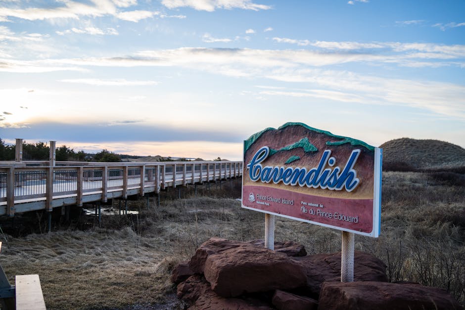 Cavendish sign by boardwalk under blue skies in Prince Edward Island, Canada.