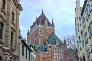 Château Frontenac and historic buildings dusted in snow in scenic Québec City Canada