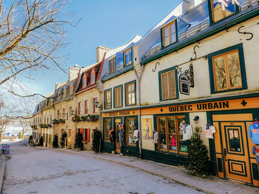 Picturesque winter scene of historic Rue du Petit-Champlain in Quebec City, showcasing colorful colonial-style architect