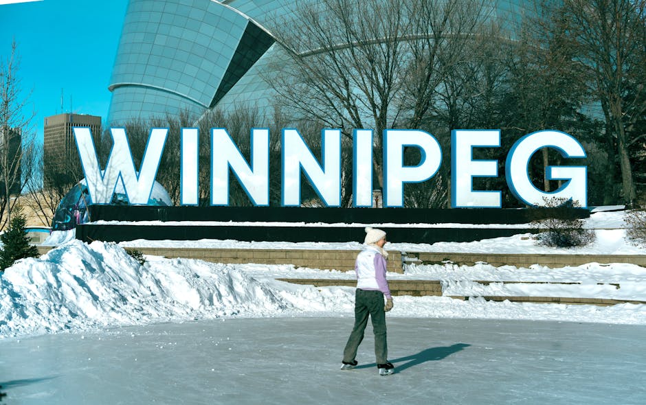 Outdoor ice skater at the Winnipeg sign during a sunny winter day.